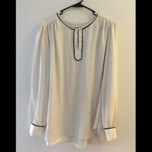 White blouse with black trim